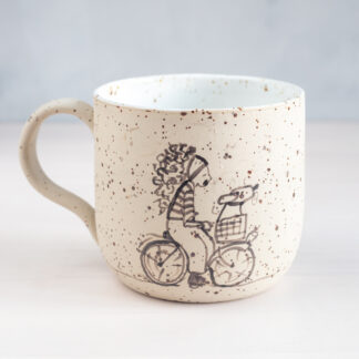 Speckled mug with illustration